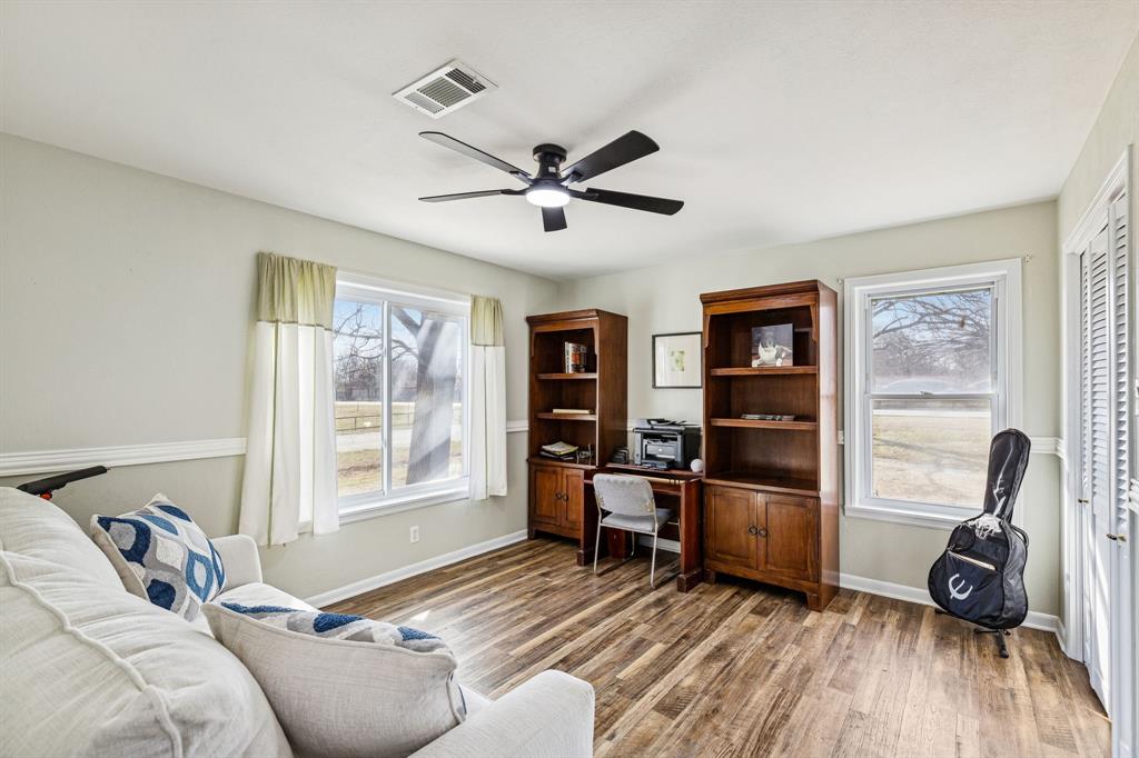 1012 Cowling Road Sanger, TX 76266 - Photo 11 of 40 a bedroom with furniture and a window