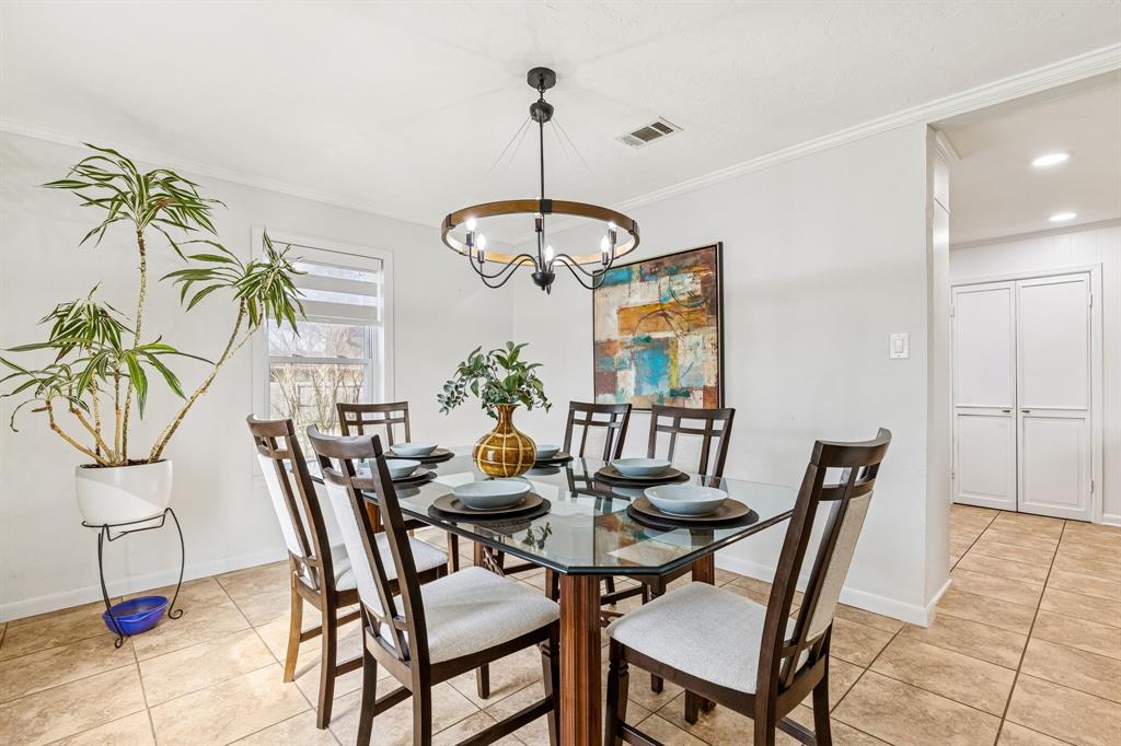 1012 Cowling Road Sanger, TX 76266 - Photo 17 of 40 a view of a dining room with furniture and chandelier