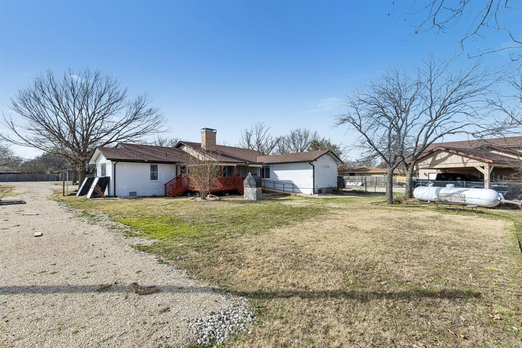 1012 Cowling Road Sanger, TX 76266 - Photo 26 of 40 a front view of a house with a yard