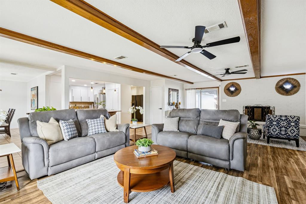 1012 Cowling Road Sanger, TX 76266 - Photo 3 of 40 a living room with furniture and wooden floor