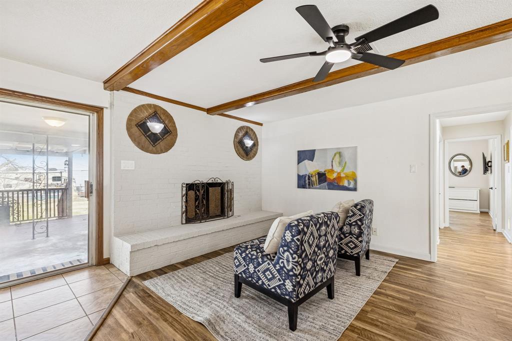 1012 Cowling Road Sanger, TX 76266 - Photo 7 of 40 a living room with furniture and a wooden floor