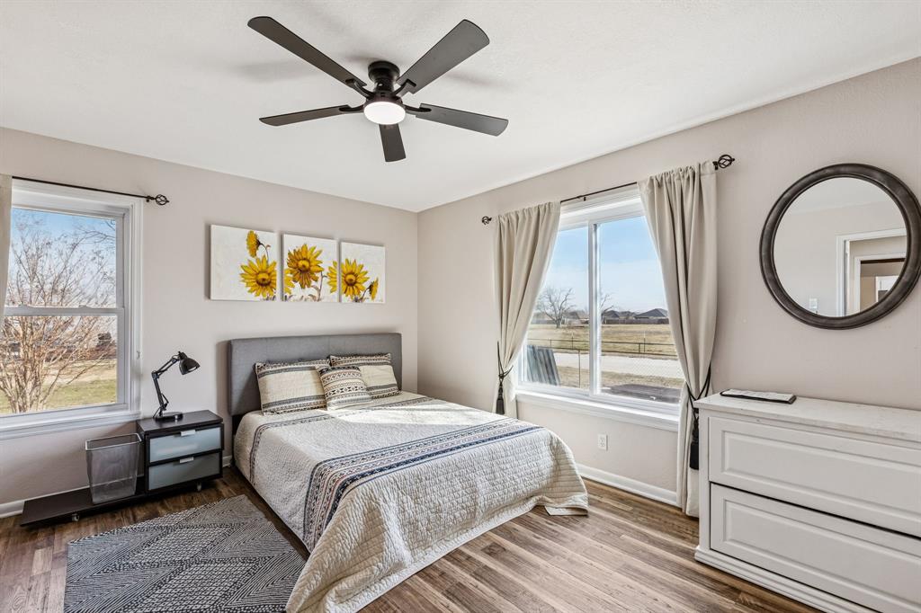 1012 Cowling Road Sanger, TX 76266 - Photo 8 of 40 a bedroom with a large bed and a window
