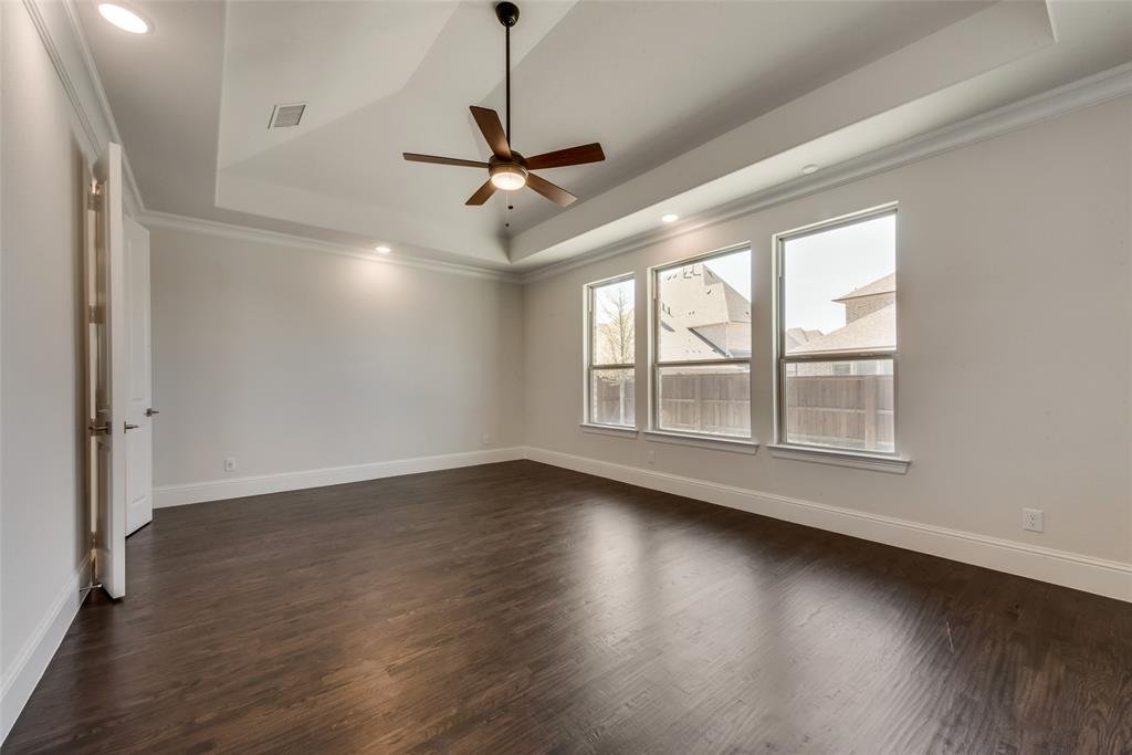 6887 Tranquility Court Frisco, TX 75034 - Photo 16 of 37 a view of an empty room with wooden floor and a window