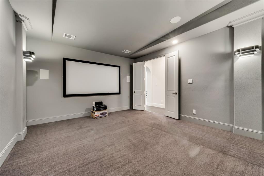 6887 Tranquility Court Frisco, TX 75034 - Photo 25 of 37 a room with gym equipment