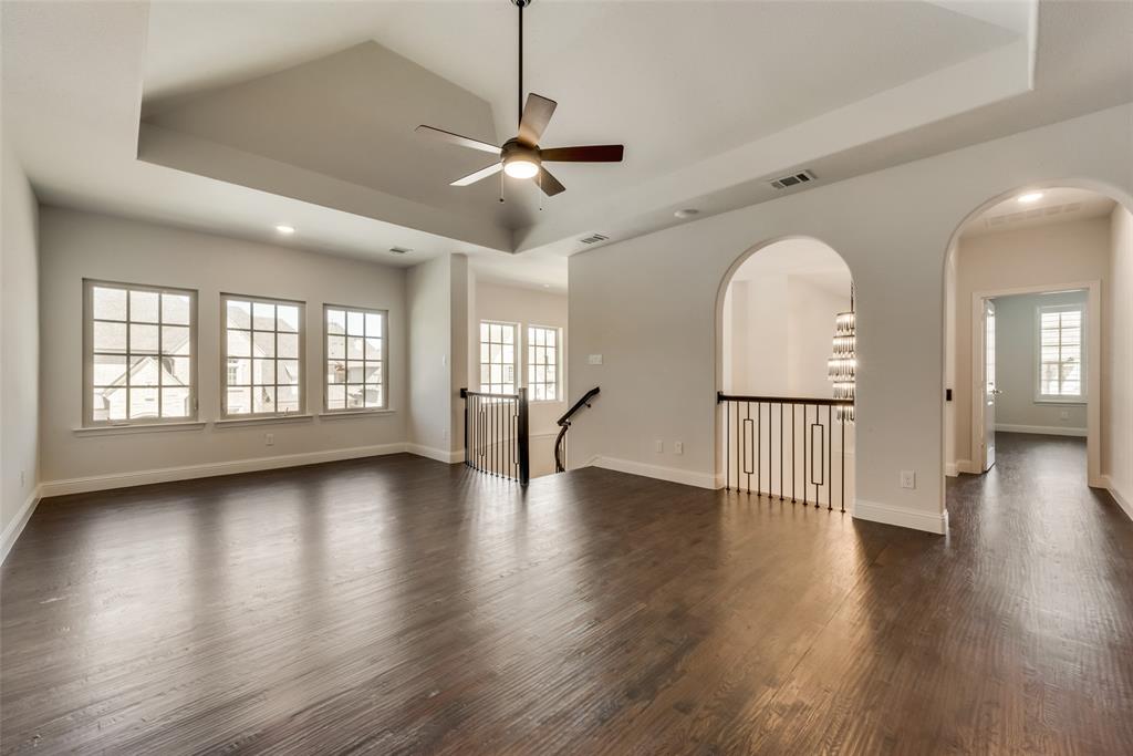 6887 Tranquility Court Frisco, TX 75034 - Photo 30 of 37 a view of empty room with wooden floor and fan