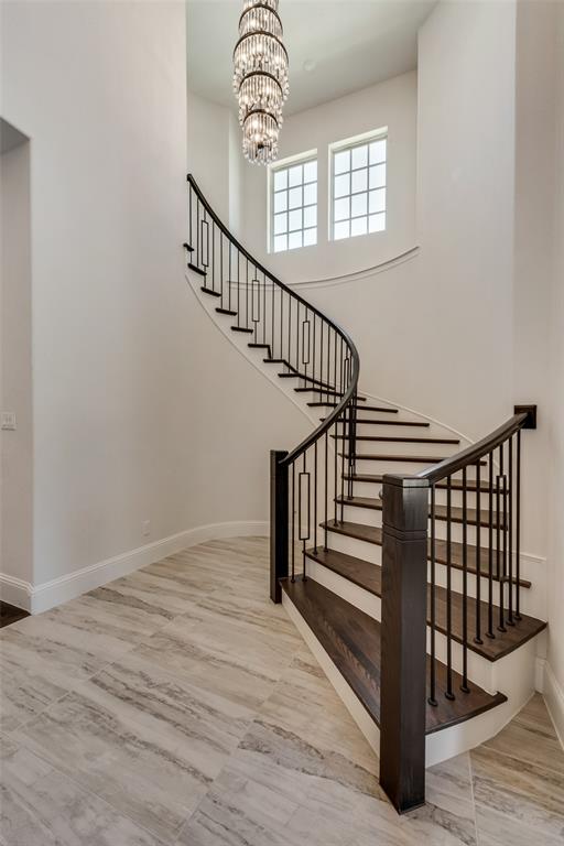 6887 Tranquility Court Frisco, TX 75034 - Photo 4 of 37 a view of entryway and hall with wooden floor