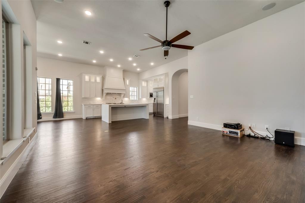 6887 Tranquility Court Frisco, TX 75034 - Photo 8 of 37 a view of kitchen with a sink a refrigerator and window