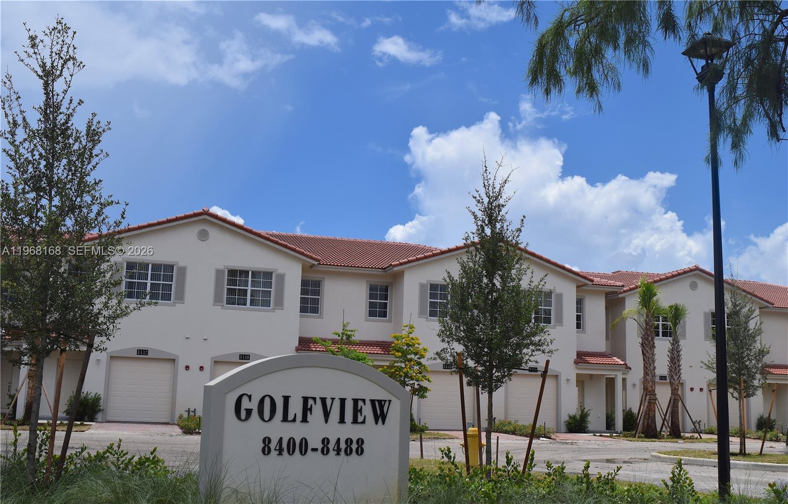 8440 West McNab Road, Unit 8440 Fort Lauderdale, FL 33321 - Photo 1 of 22 a front view of a house with garden