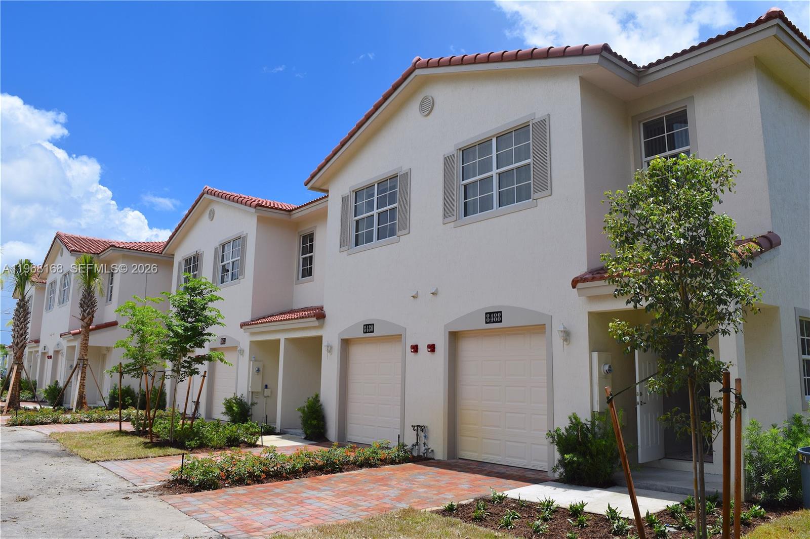 8440 West McNab Road, Unit 8440 Fort Lauderdale, FL 33321 - Photo 2 of 22 a front view of a house with a yard