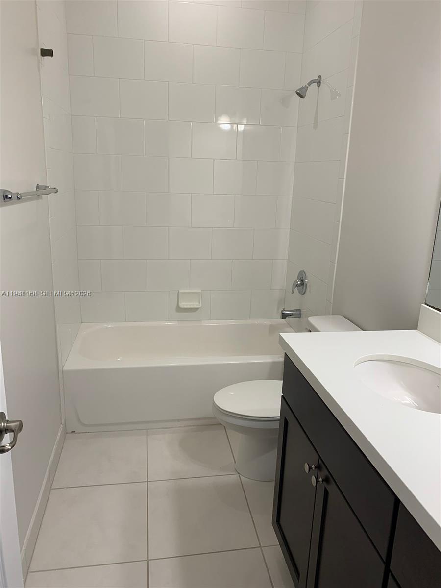 8440 West McNab Road, Unit 8440 Fort Lauderdale, FL 33321 - Photo 21 of 22 a bathroom with a sink a toilet and bathtub