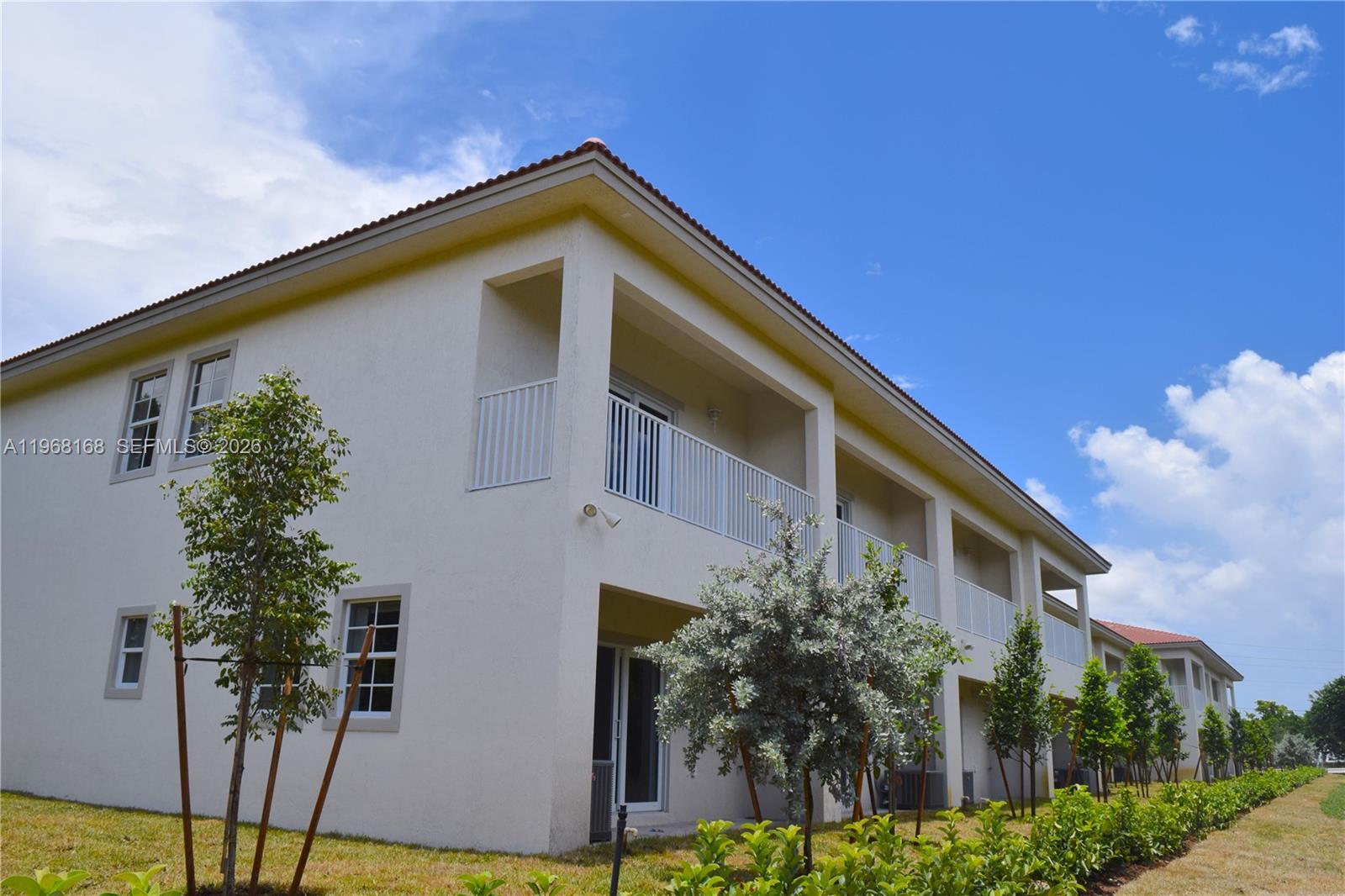 8440 West McNab Road, Unit 8440 Fort Lauderdale, FL 33321 - Photo 4 of 22 a front view of a house with a yard