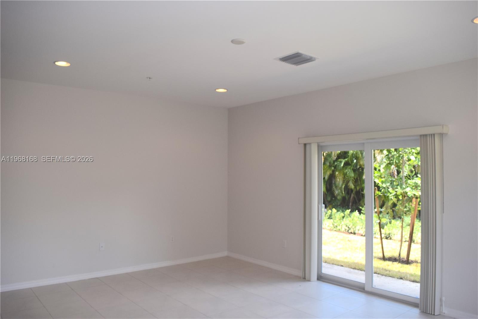 8440 West McNab Road, Unit 8440 Fort Lauderdale, FL 33321 - Photo 8 of 22 a view of an empty room with a window