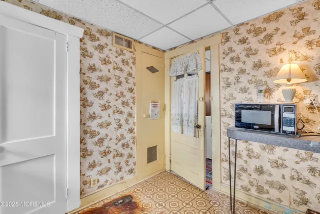 a kitchen with a stove a sink and a refrigerator