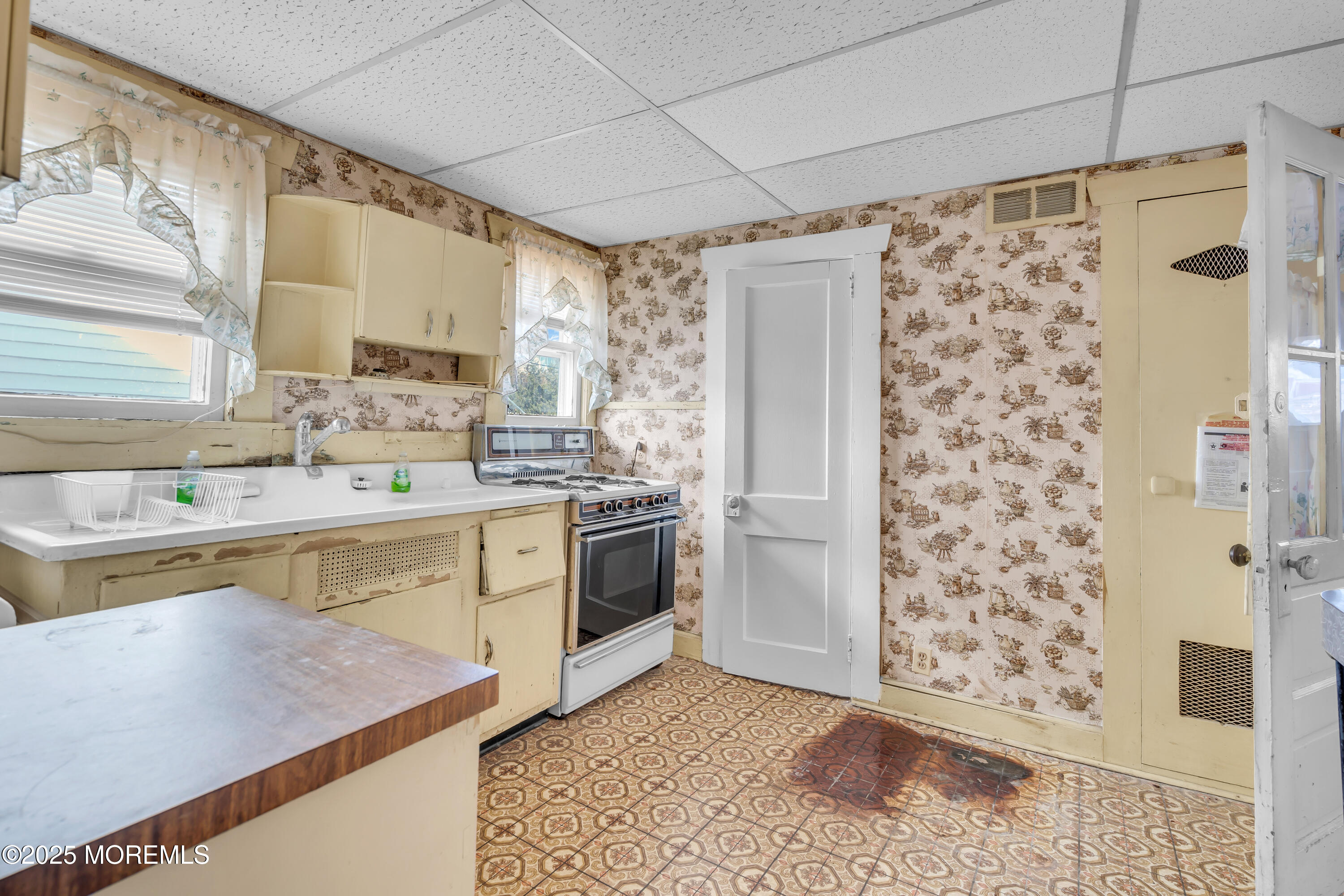 1812 Fernwood Road, Unit 2 Belmar, NJ 07719 - Photo 13 of 41 a kitchen with a stove a sink and a refrigerator