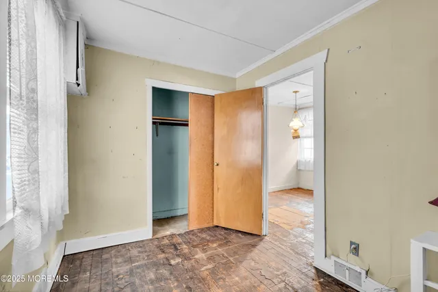 a bathroom with a sink a toilet and a window