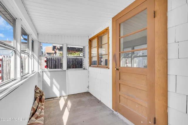 wooden floor and windows in an empty room