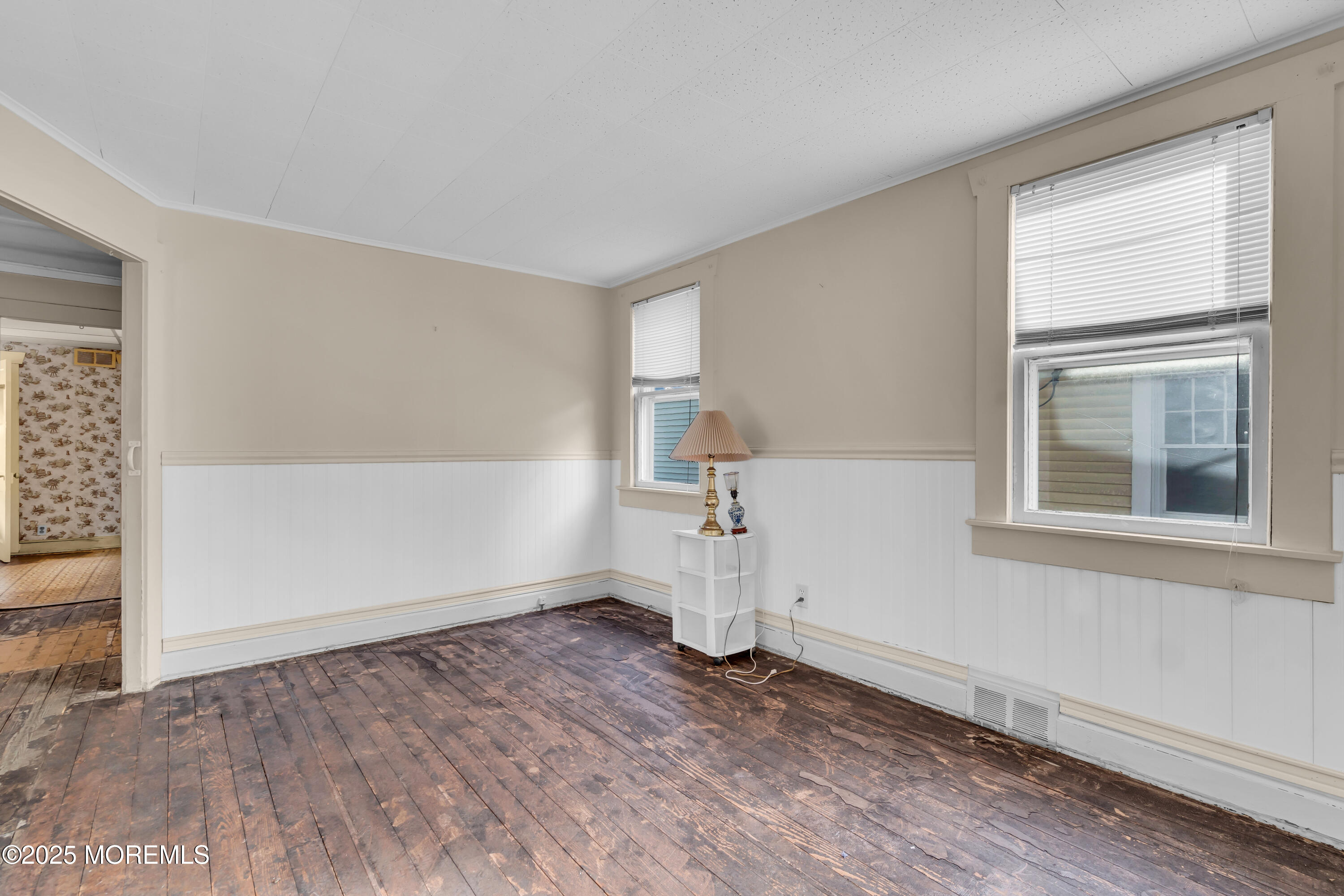 1812 Fernwood Road, Unit 2 Belmar, NJ 07719 - Photo 7 of 41 an empty room with wooden floor and windows