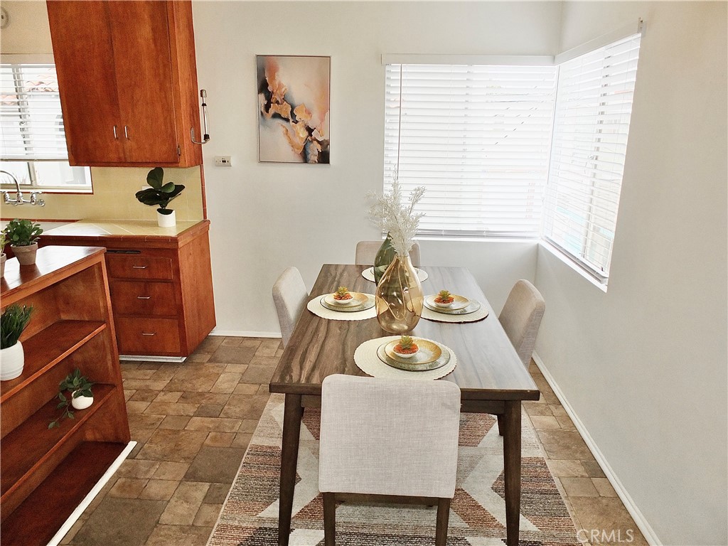 1335 East Appleton Street, Unit 8 Long Beach, CA 90802 - Photo 16 of 47 a view of a dining room with furniture and window