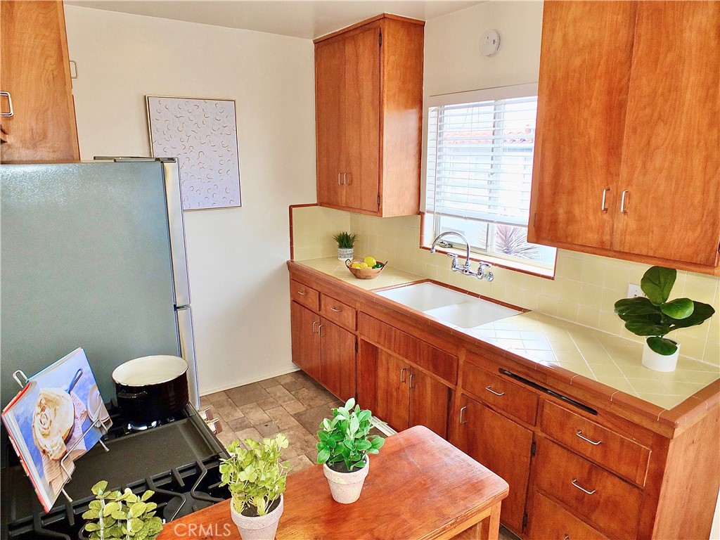 1335 East Appleton Street, Unit 8 Long Beach, CA 90802 - Photo 21 of 47 a bathroom with a sink a toilet and mirror