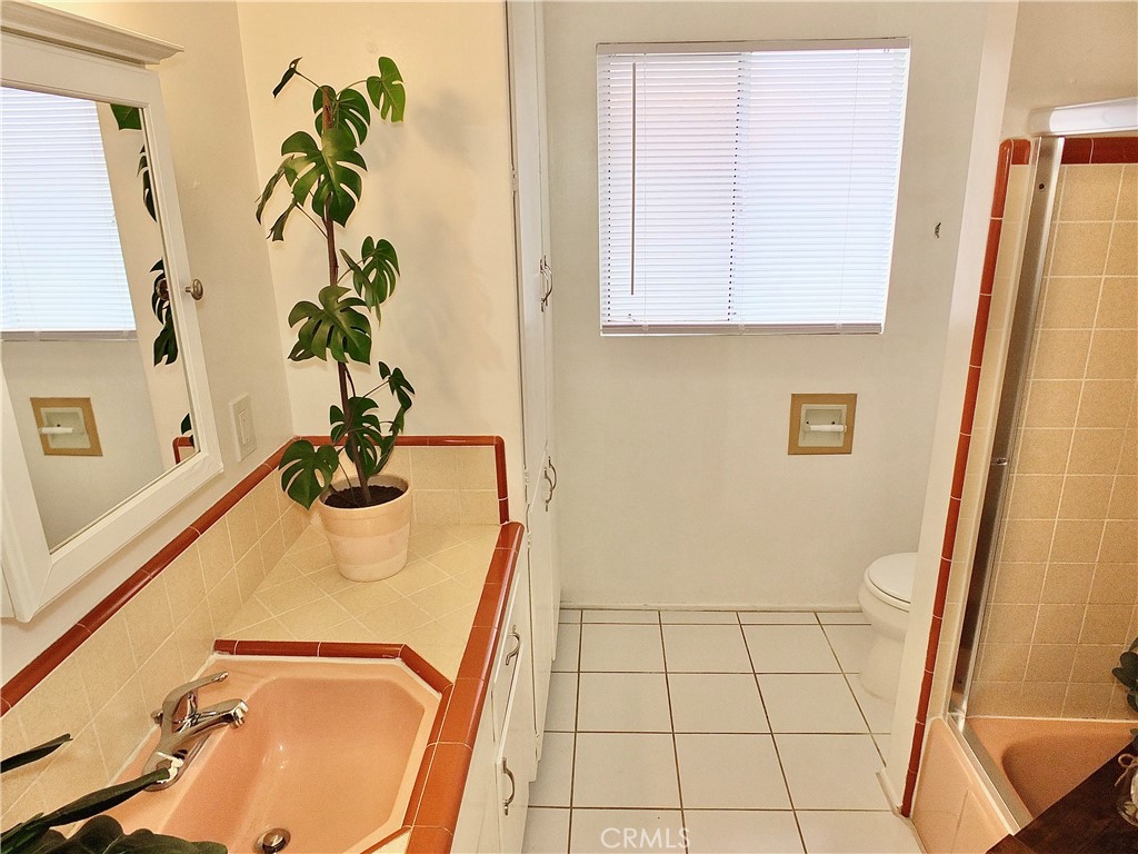 1335 East Appleton Street, Unit 8 Long Beach, CA 90802 - Photo 26 of 47 a bathroom with a sink and a mirror