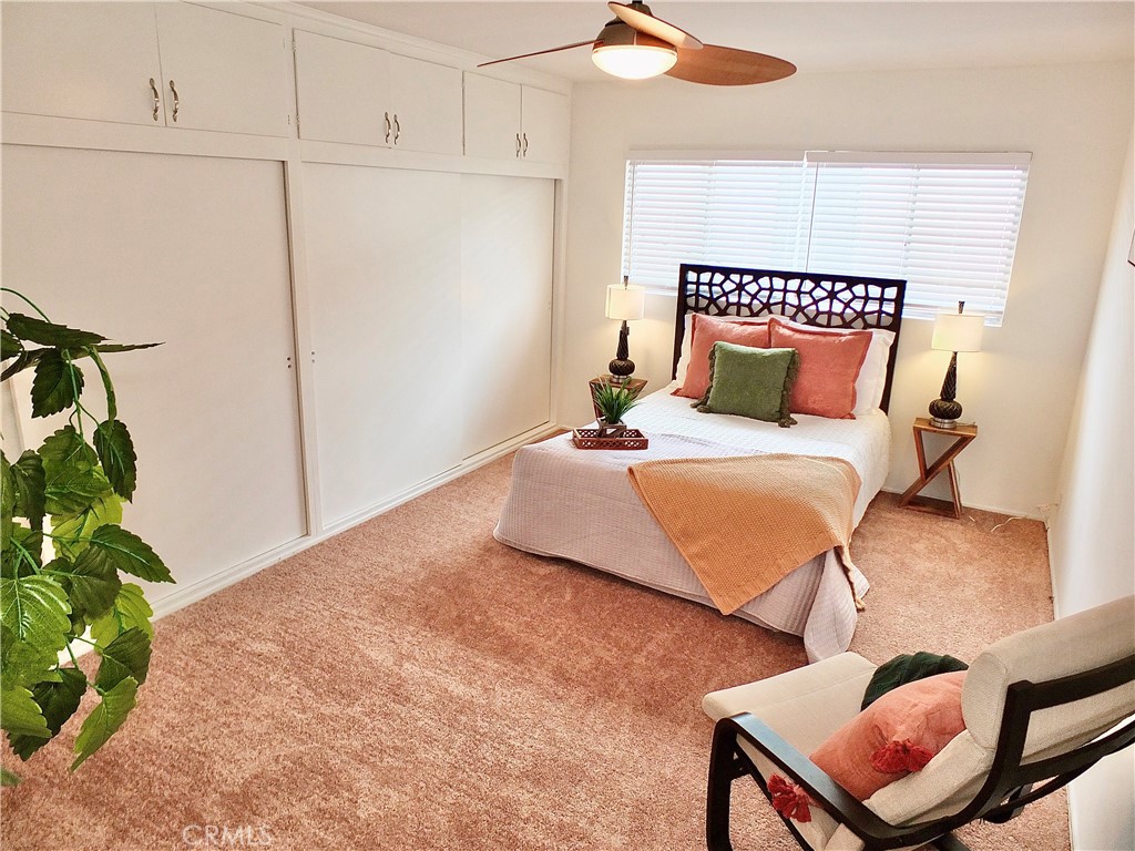 1335 East Appleton Street, Unit 8 Long Beach, CA 90802 - Photo 33 of 47 a bedroom with a bed and a potted plant