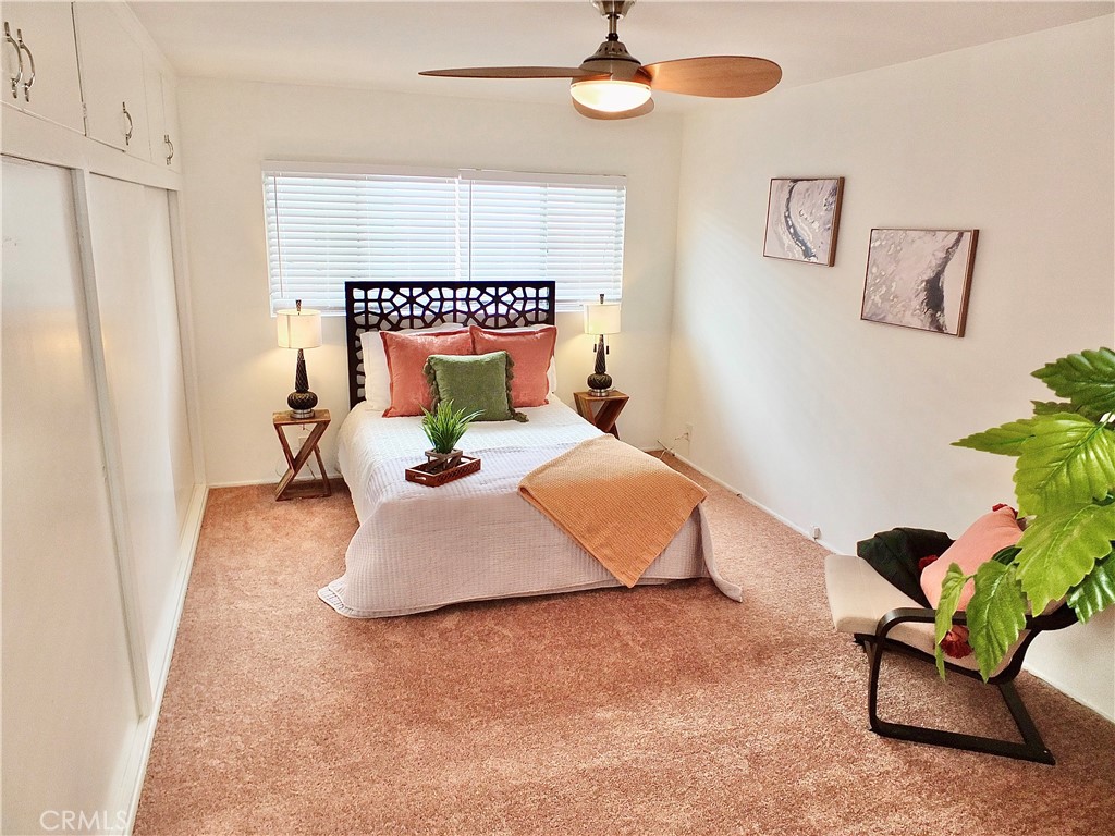 1335 East Appleton Street, Unit 8 Long Beach, CA 90802 - Photo 34 of 47 a bedroom with a bed potted plant with the wooden floor