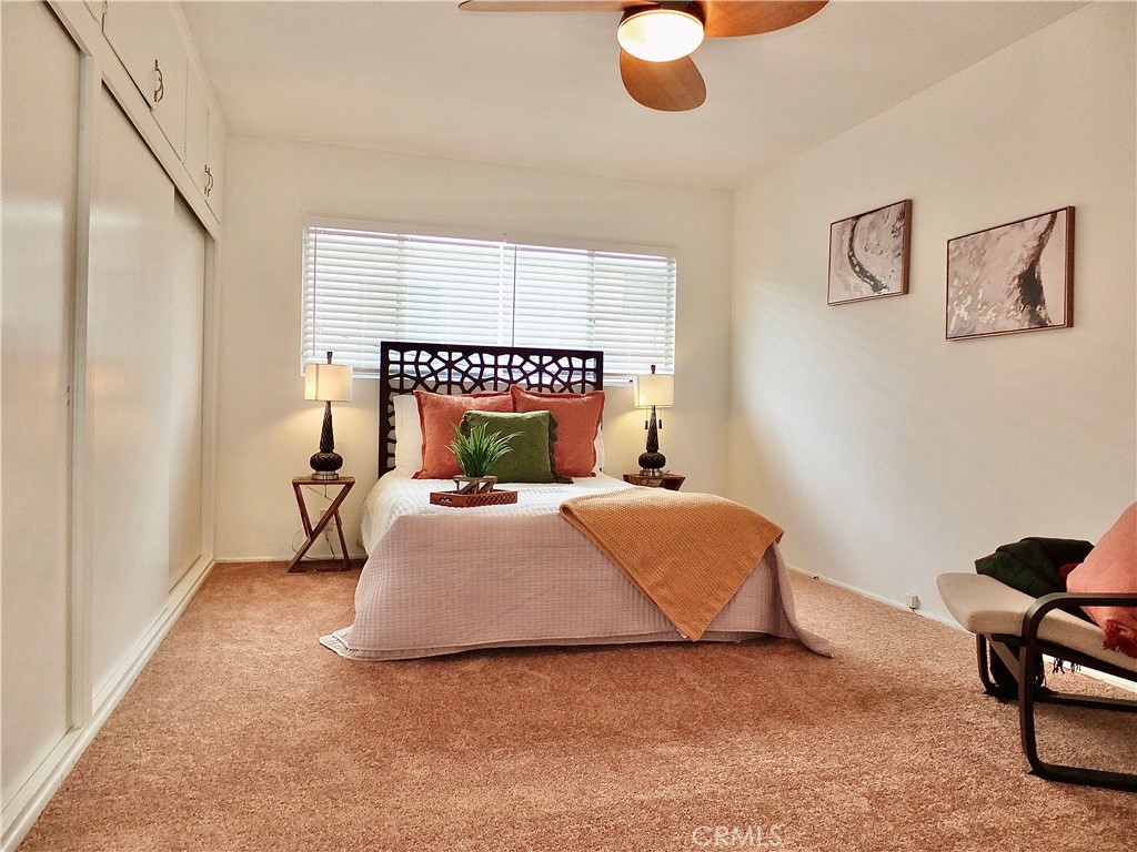 1335 East Appleton Street, Unit 8 Long Beach, CA 90802 - Photo 35 of 47 a bedroom with a bed and a cabinets