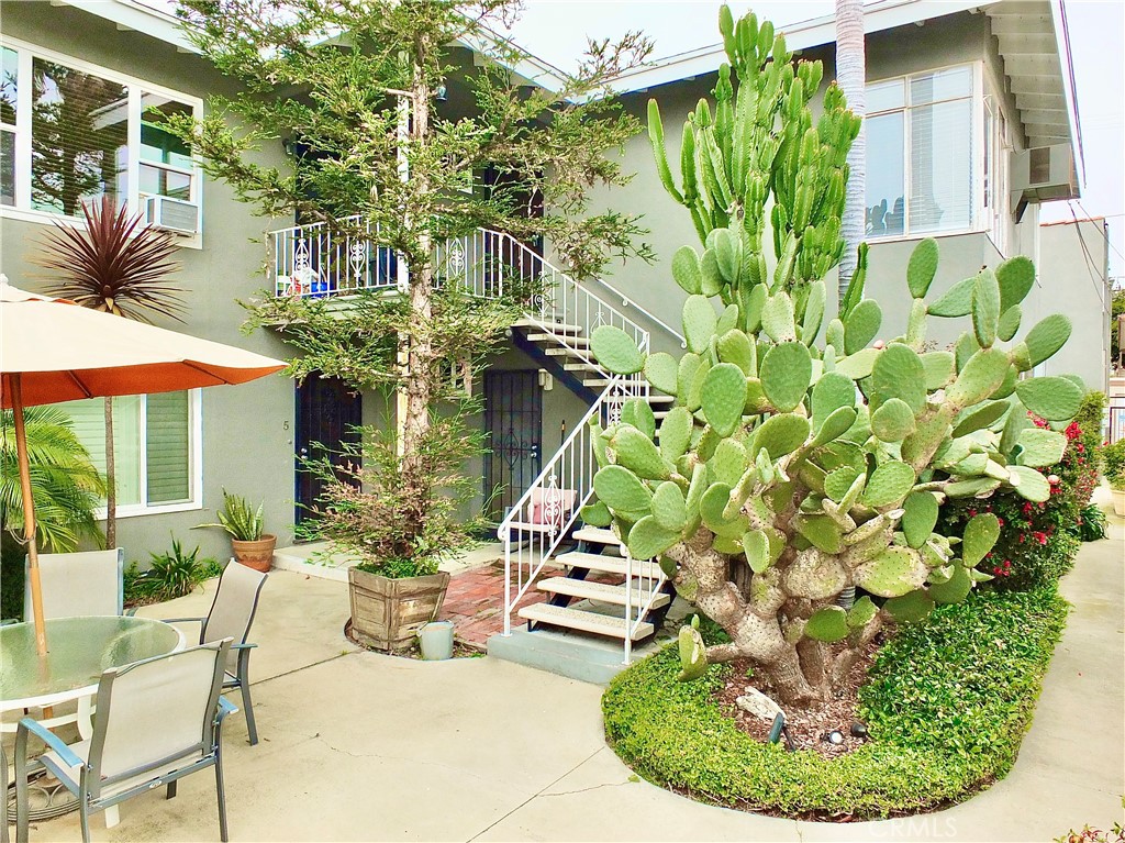 1335 East Appleton Street, Unit 8 Long Beach, CA 90802 - Photo 4 of 47 a view of a chairs and table in a patio