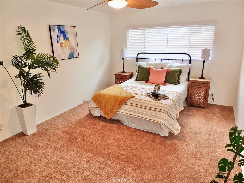 1335 East Appleton Street, Unit 8 Long Beach, CA 90802 - Photo 42 of 47 a bedroom with a bed and a painting on the wall