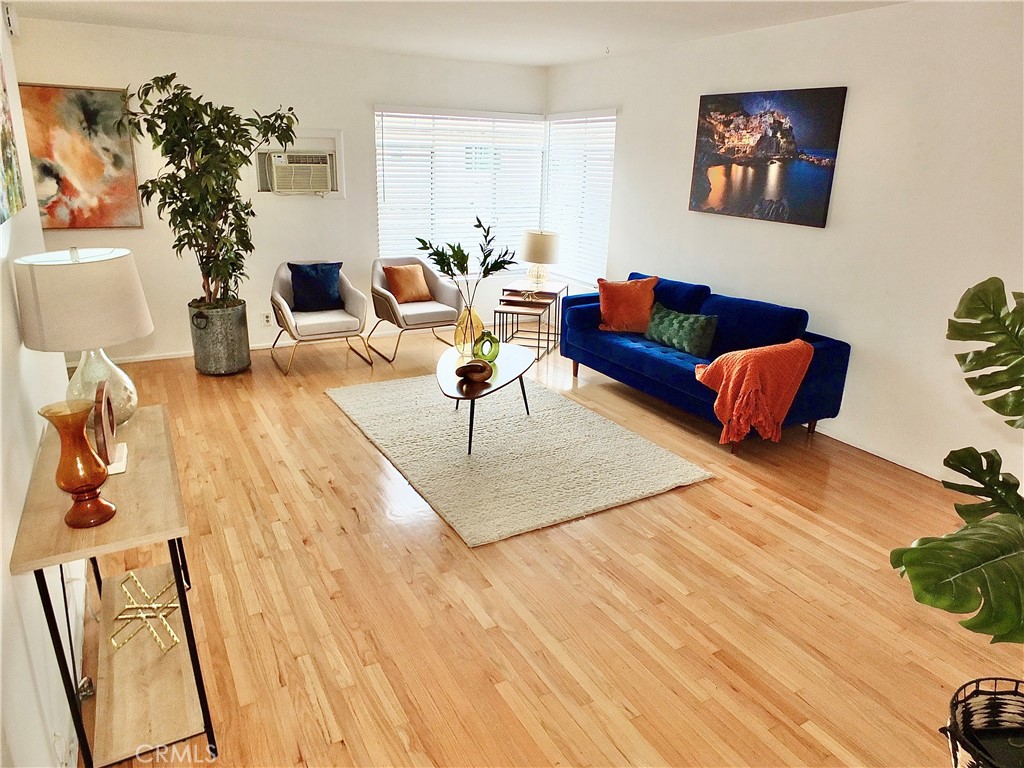 1335 East Appleton Street, Unit 8 Long Beach, CA 90802 - Photo 7 of 47 a living room with furniture and a potted plant