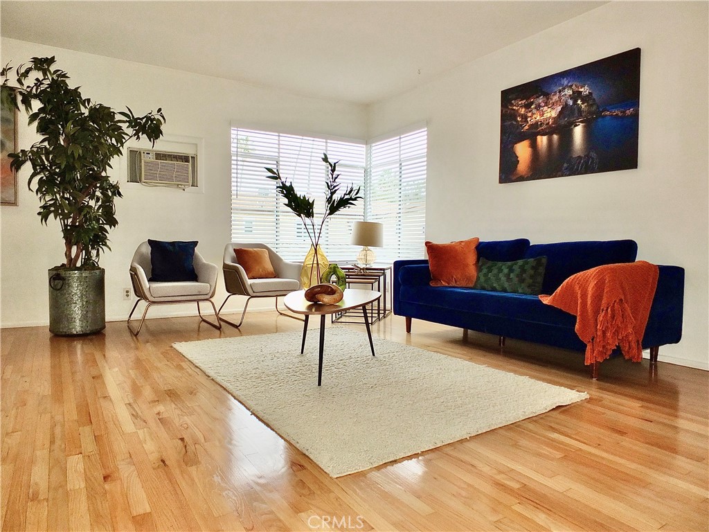 1335 East Appleton Street, Unit 8 Long Beach, CA 90802 - Photo 8 of 47 a living room with furniture and a potted plant