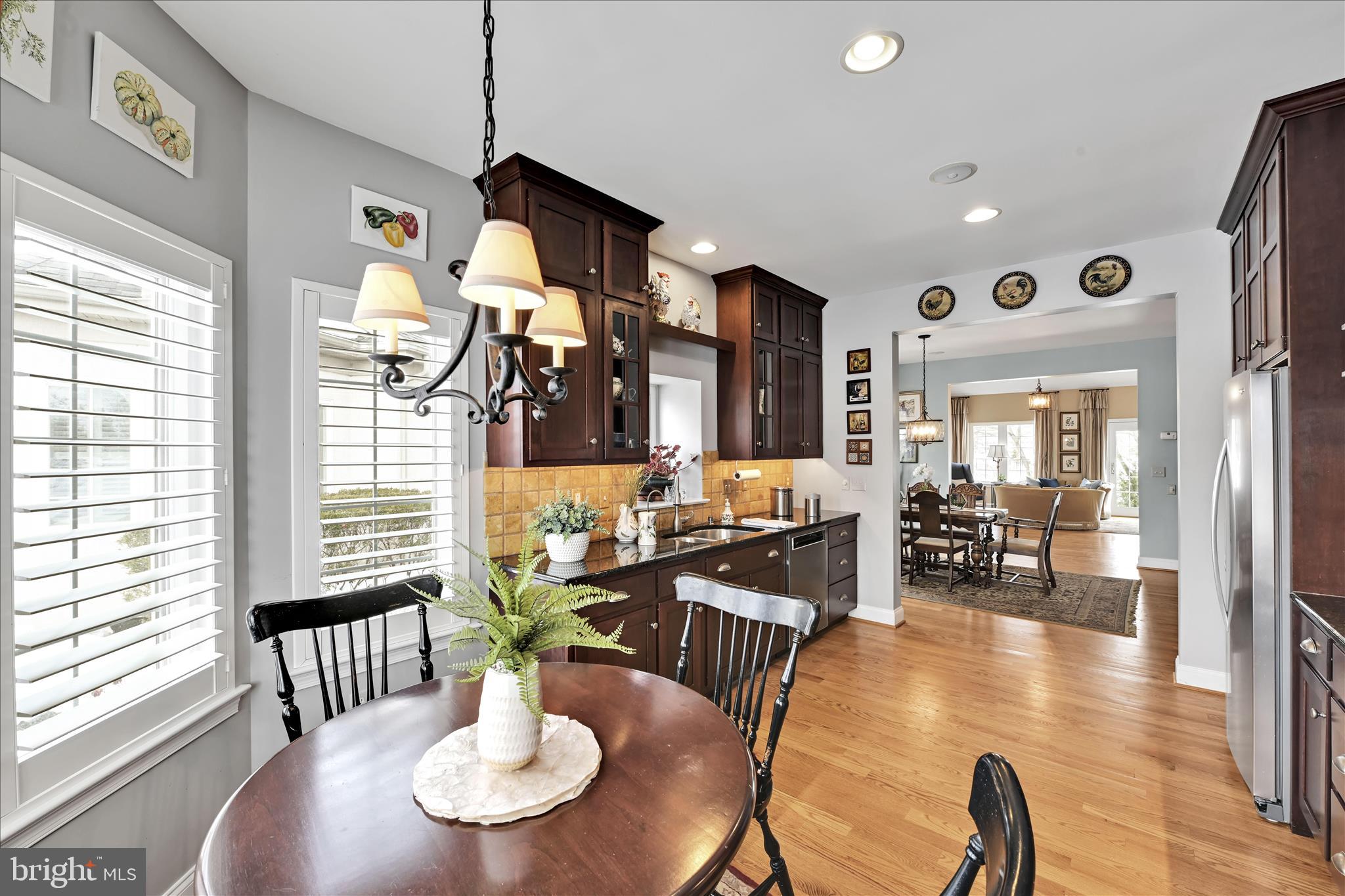 728 Woodfield Drive Lititz, PA 17543 - Photo 17 of 61 a view of a dining room with furniture wooden floor and chandelier