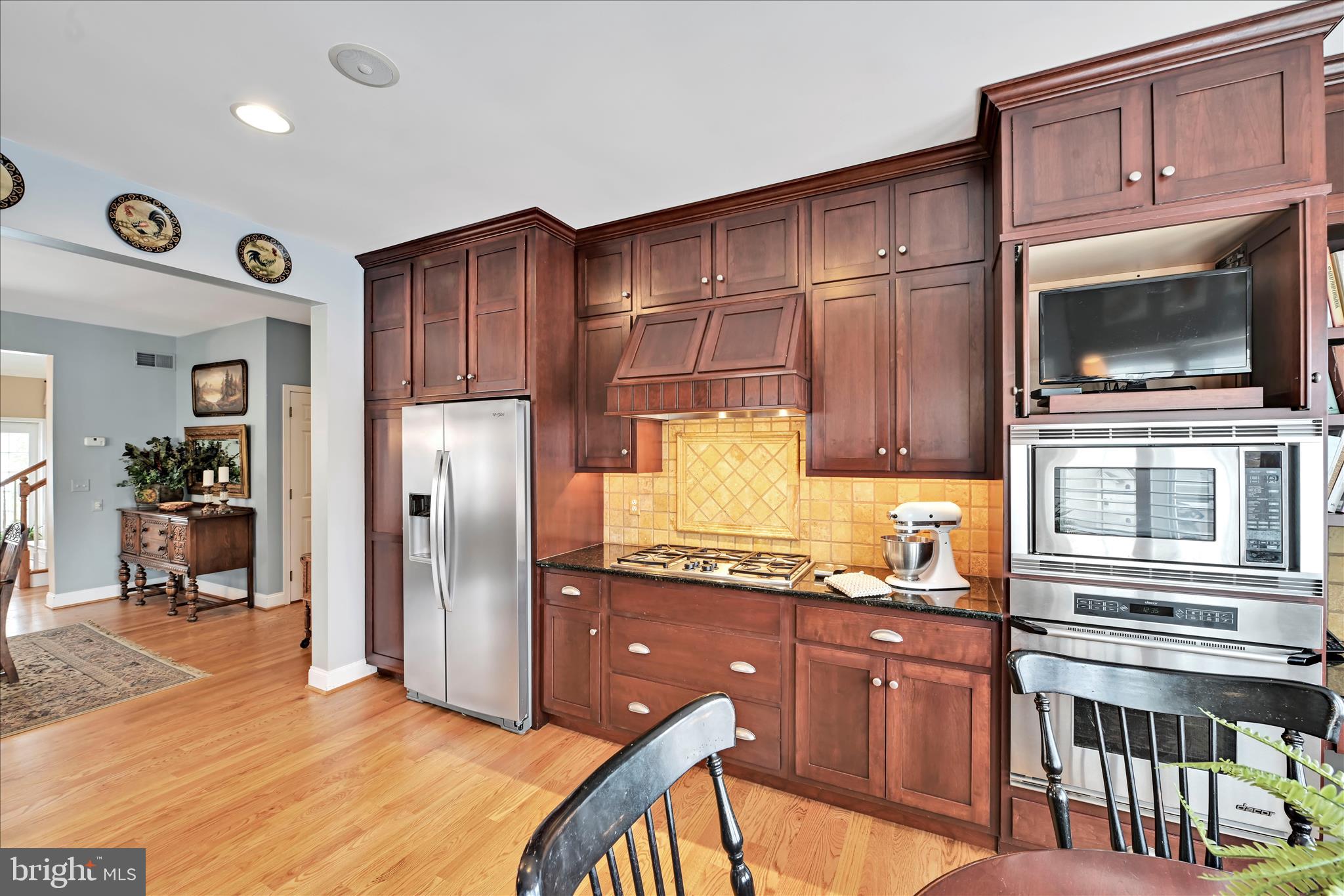 728 Woodfield Drive Lititz, PA 17543 - Photo 18 of 61 a kitchen with granite countertop stainless steel appliances and wooden cabinets