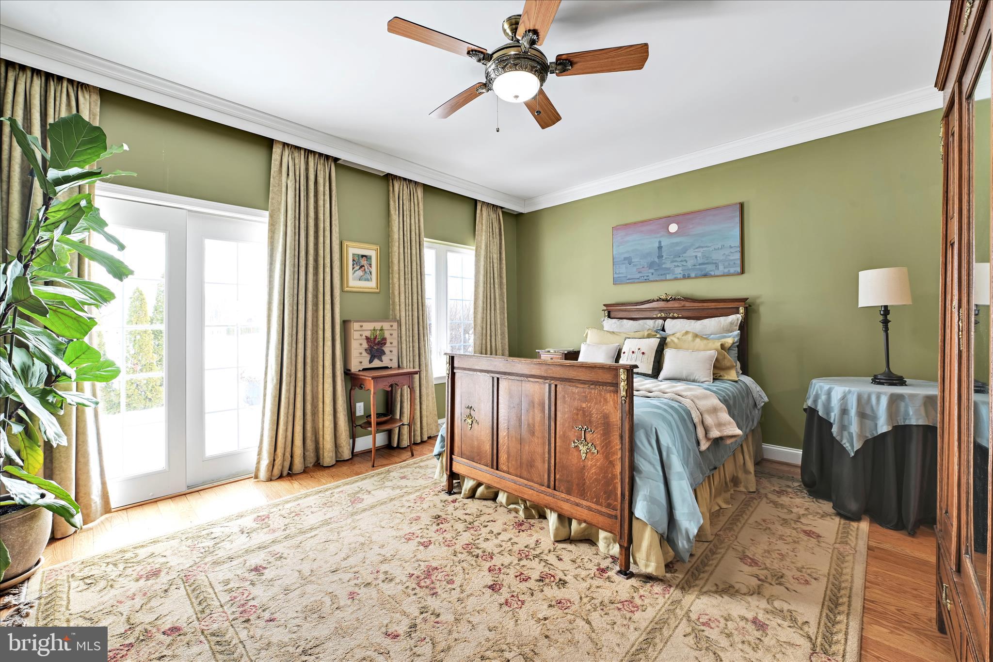 728 Woodfield Drive Lititz, PA 17543 - Photo 22 of 61 a bed room with a bed and a chandelier