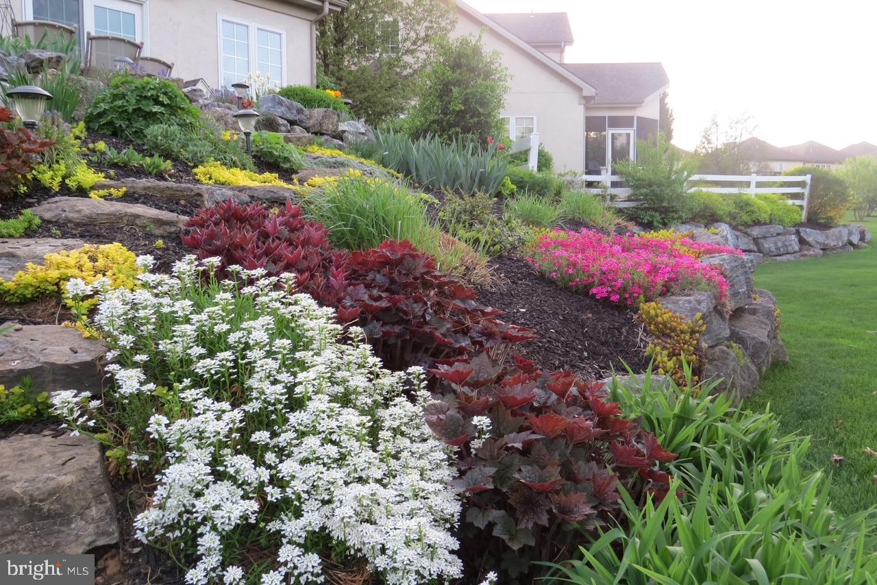 728 Woodfield Drive Lititz, PA 17543 - Photo 46 of 61 a view of a house with a yard and garden