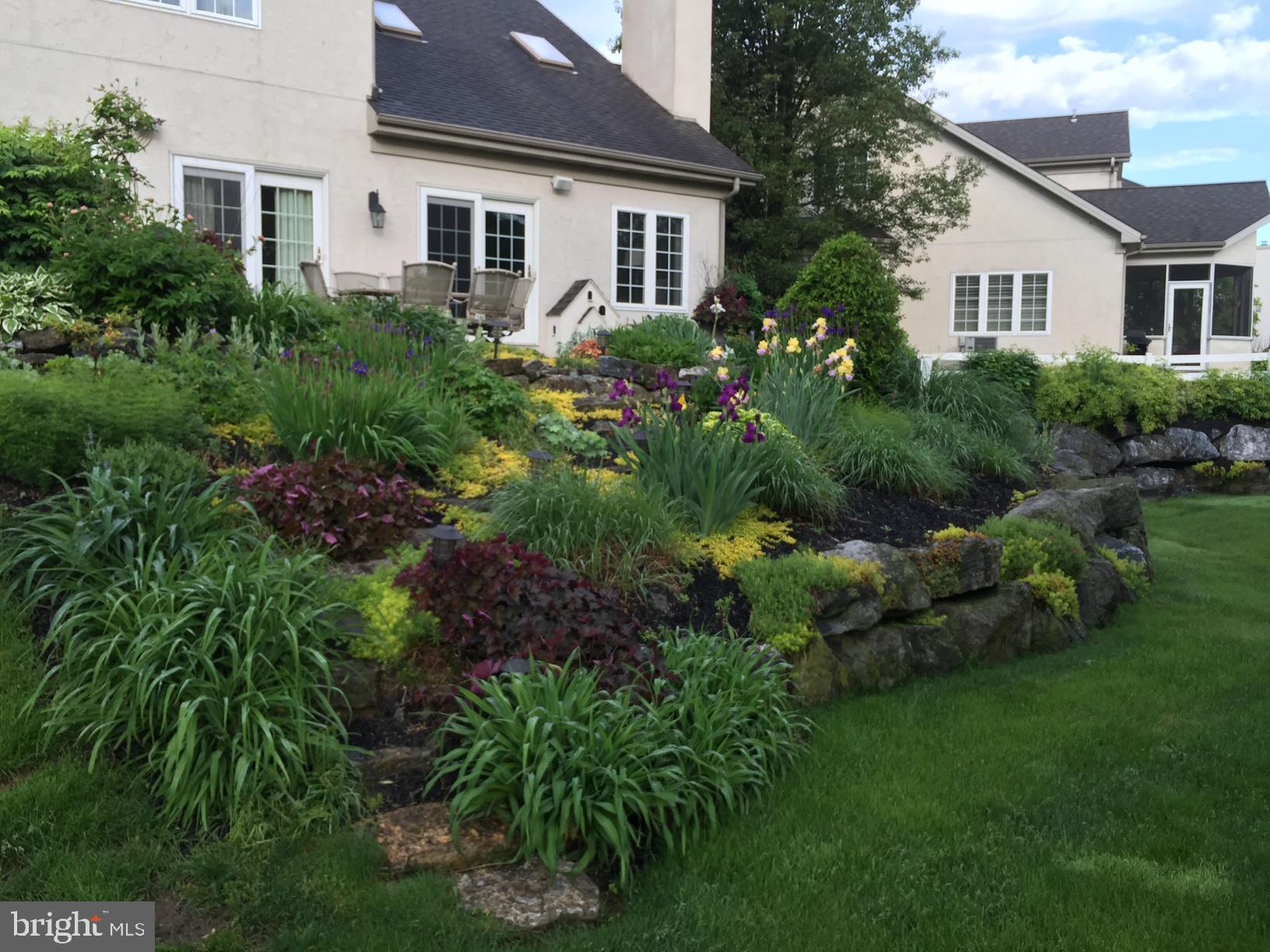 728 Woodfield Drive Lititz, PA 17543 - Photo 48 of 61 a view of a house with a yard and garden