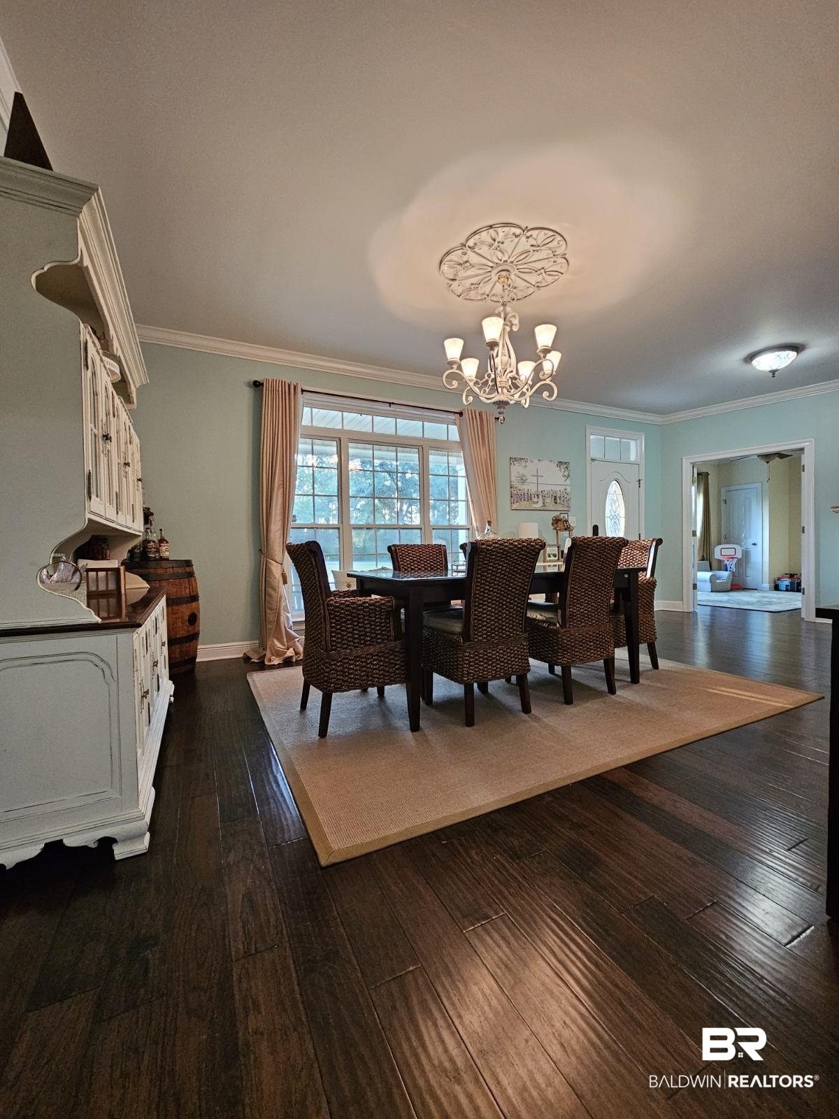 41416 Davis Duck Road Bay Minette, AL 36507 - Photo 23 of 72 Dining room with dark hardwood / wood-style floors, crown molding, and a chandelier