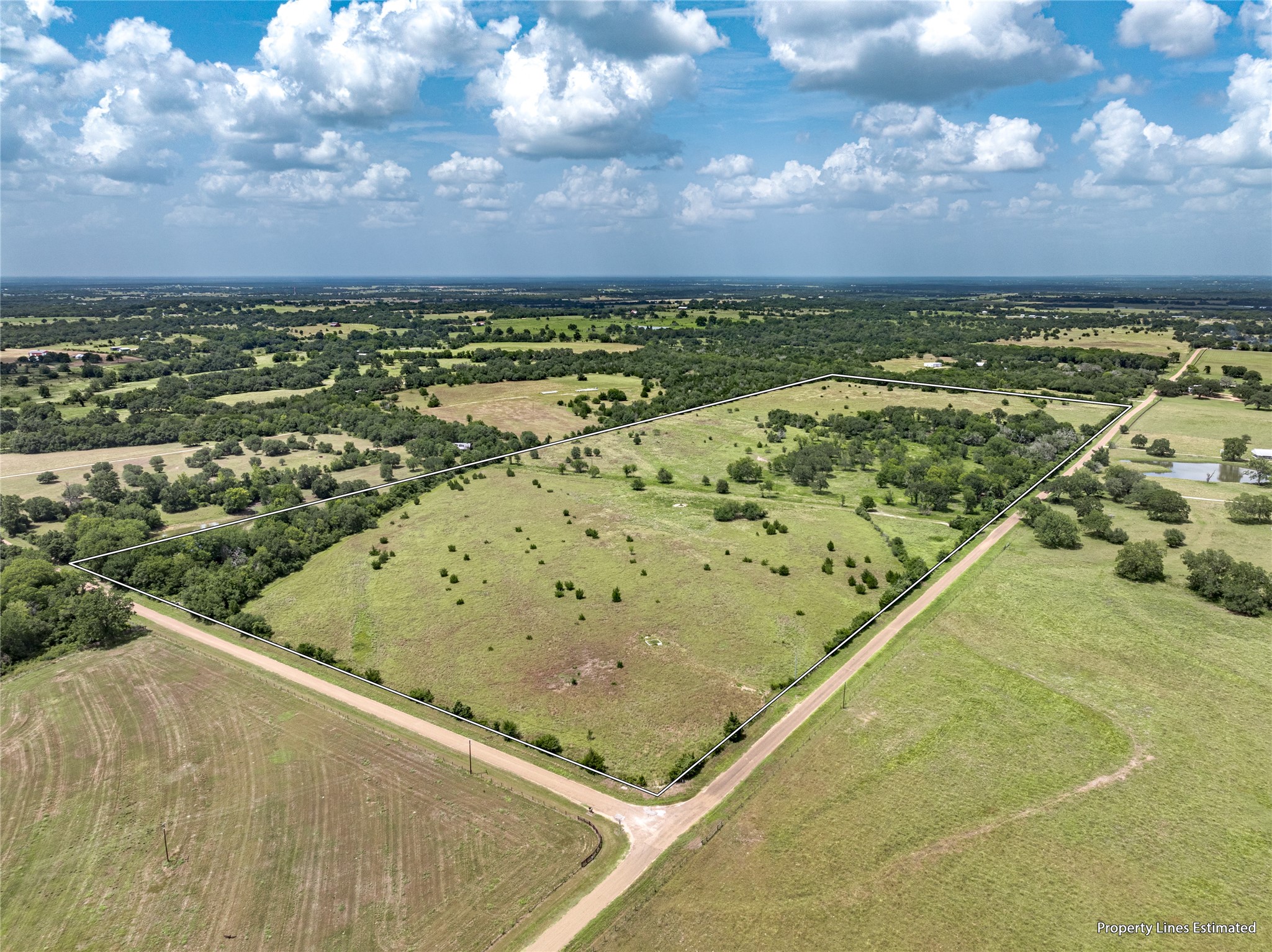 6700 Walhalla Road Round Top, TX 78954 - Photo 1 of 17 a view of a swimming pool and an outdoor seating