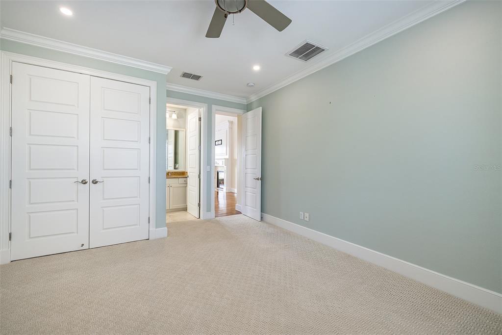821 Bay Point Drive Madeira Beach, FL 33708 - Photo 26 of 66 an empty room with ceiling fan and window
