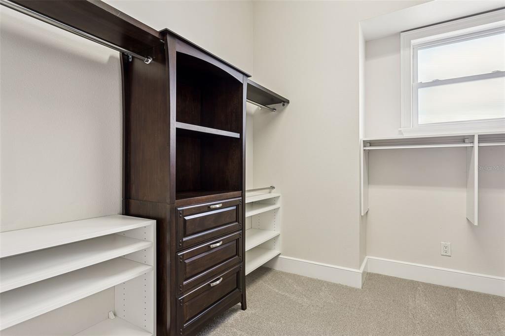 821 Bay Point Drive Madeira Beach, FL 33708 - Photo 33 of 66 a view of walk in closet with empty racks