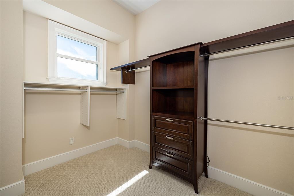 821 Bay Point Drive Madeira Beach, FL 33708 - Photo 34 of 66 a bathroom with a walk in closet and window