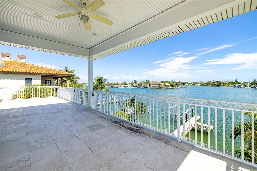 821 Bay Point Drive Madeira Beach, FL 33708 - Photo 38 of 66 a view of a balcony with couches