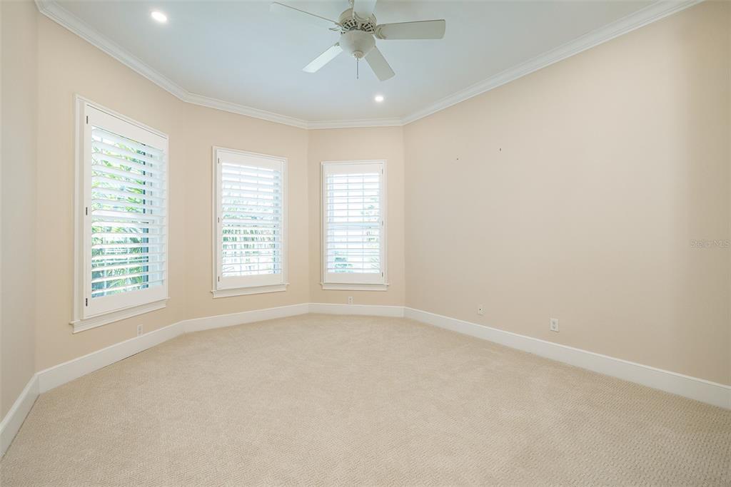 821 Bay Point Drive Madeira Beach, FL 33708 - Photo 40 of 66 an empty room with a window and a ceiling fan