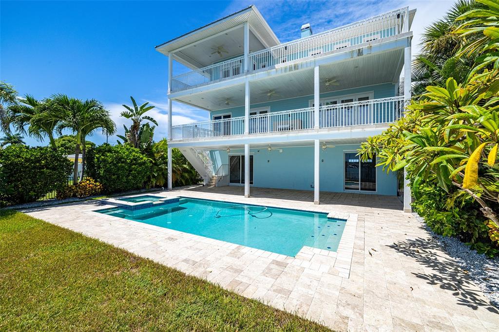 821 Bay Point Drive Madeira Beach, FL 33708 - Photo 4 of 66 a view of a house with a yard and sitting area