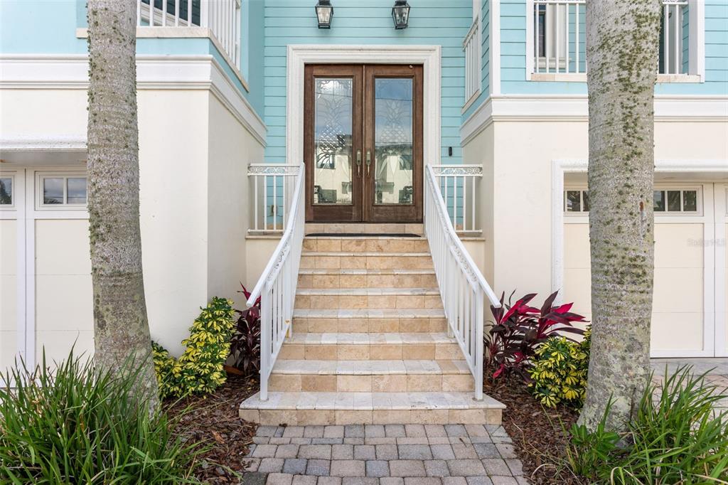 821 Bay Point Drive Madeira Beach, FL 33708 - Photo 52 of 66 a front view of a house with potted plants