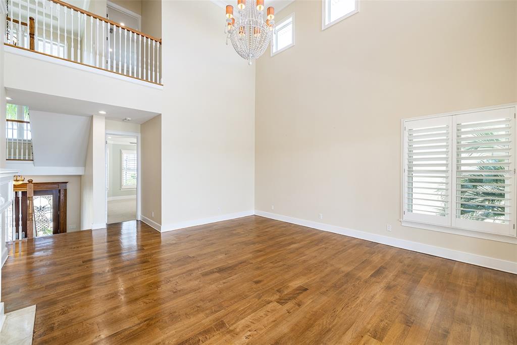 821 Bay Point Drive Madeira Beach, FL 33708 - Photo 53 of 66 a view of an empty room with wooden floor and a window