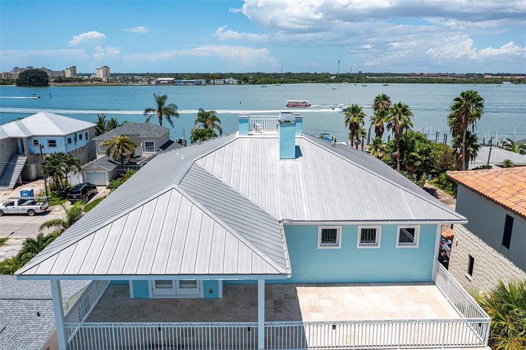821 Bay Point Drive Madeira Beach, FL 33708 - Photo 56 of 66 a view of a house with outdoor space and lake view in back