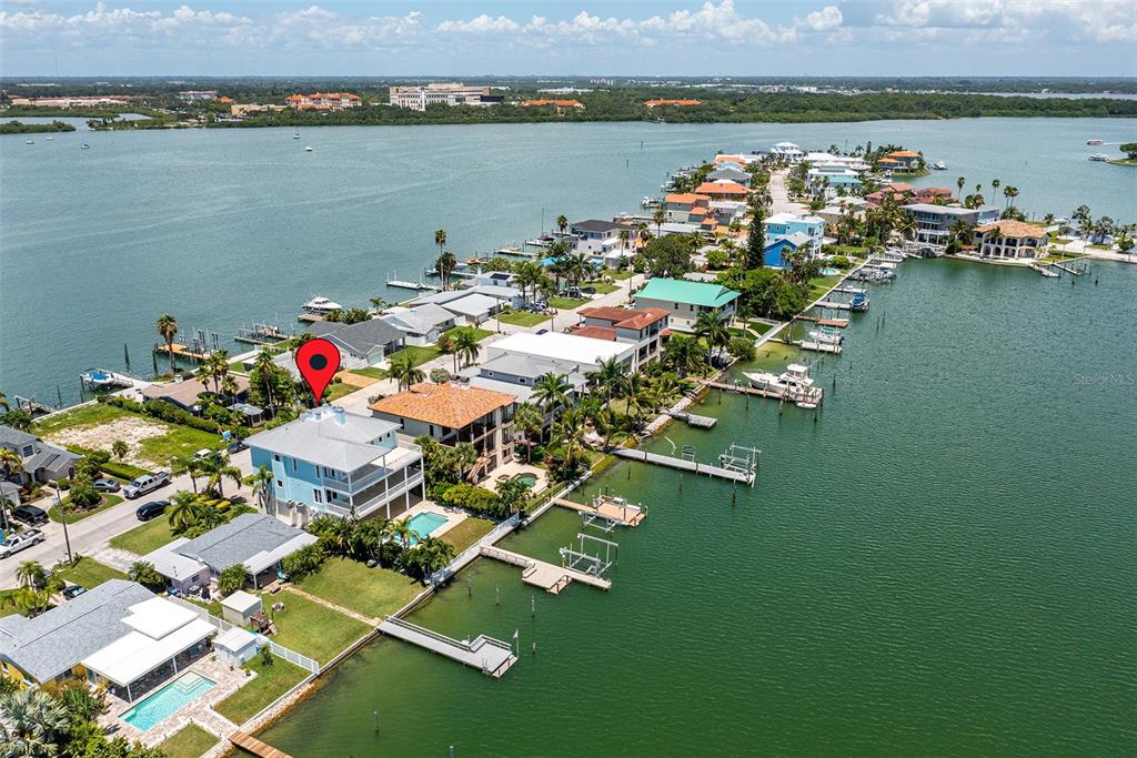 821 Bay Point Drive Madeira Beach, FL 33708 - Photo 60 of 66 an aerial view of a house with a lake view