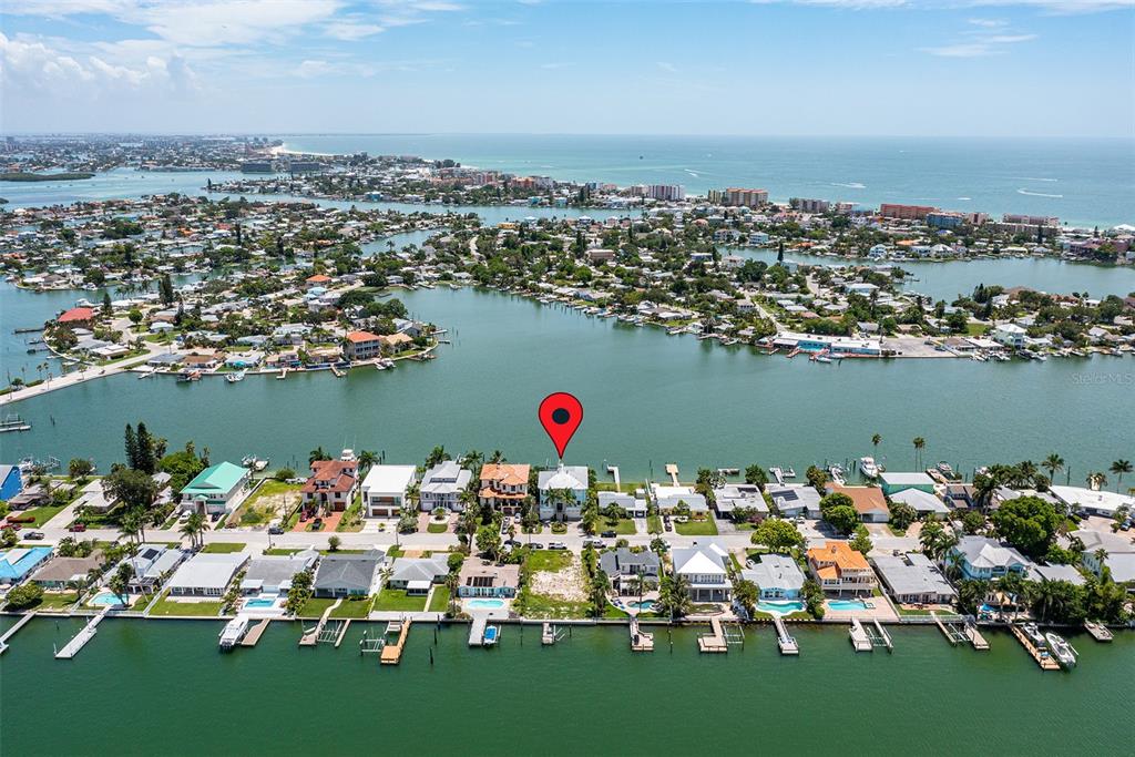 821 Bay Point Drive Madeira Beach, FL 33708 - Photo 63 of 66 an aerial view of a town with couple of boats