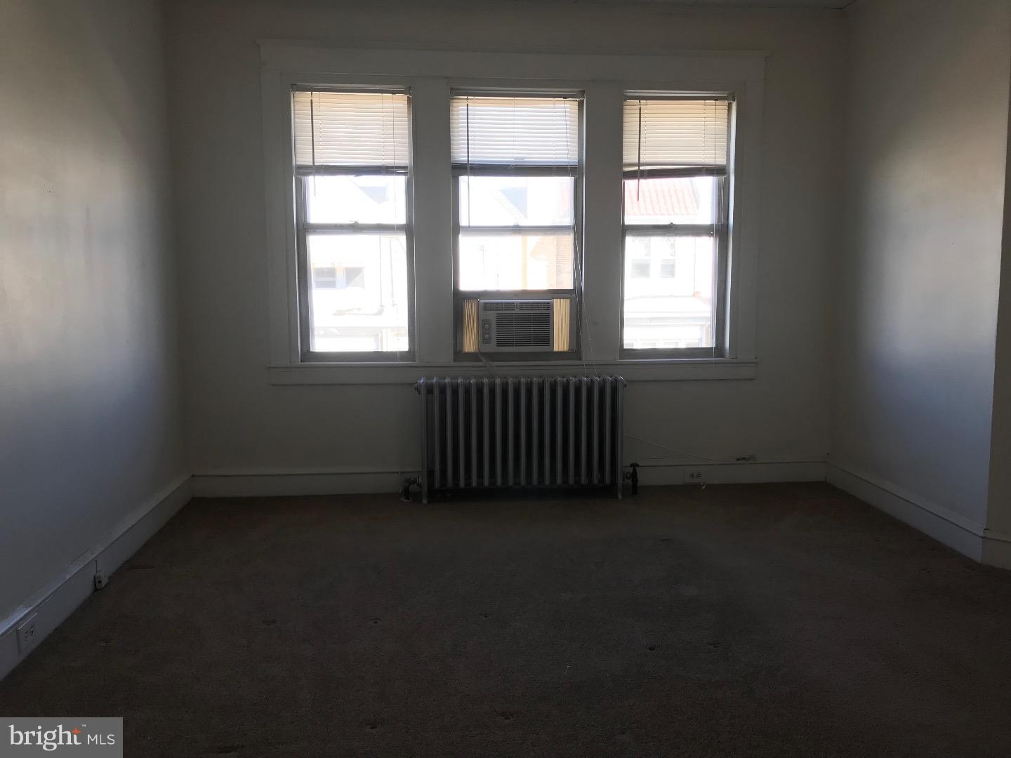 212 Wembly Road Upper Darby, PA 19082 - Photo 8 of 12 an empty room with a window